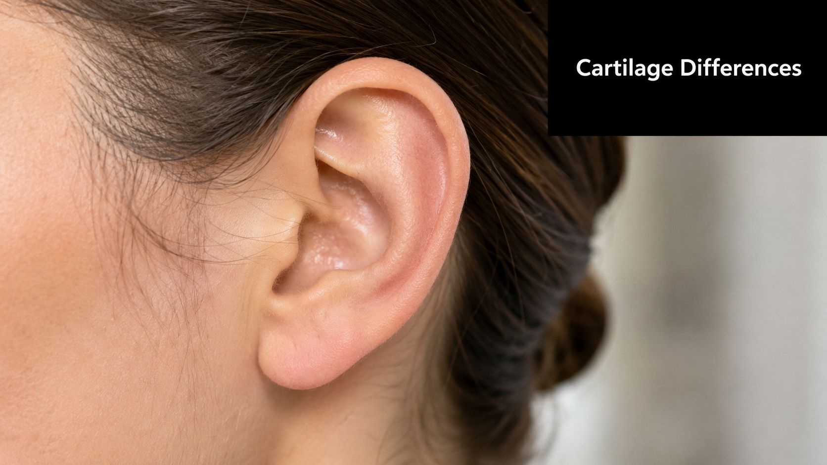 A close-up view of a woman's right ear highlighting the anatomy of the outer ear structure.