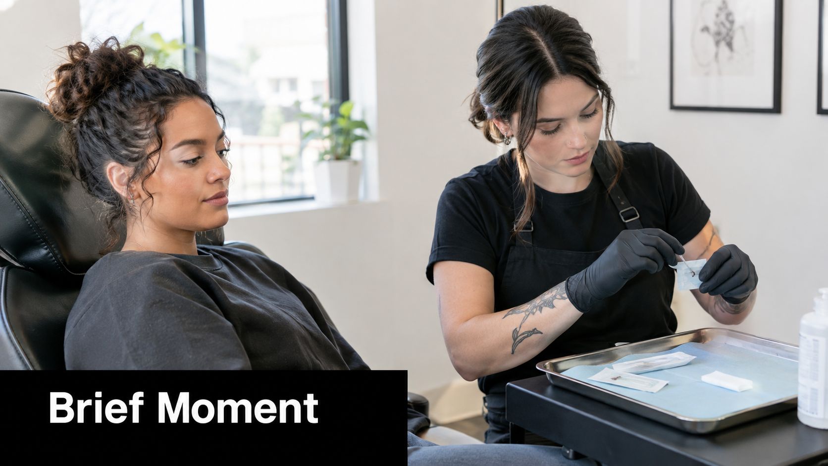 A professional piercer carefully prepares equipment for a customer before a facial piercing procedure in a studio.