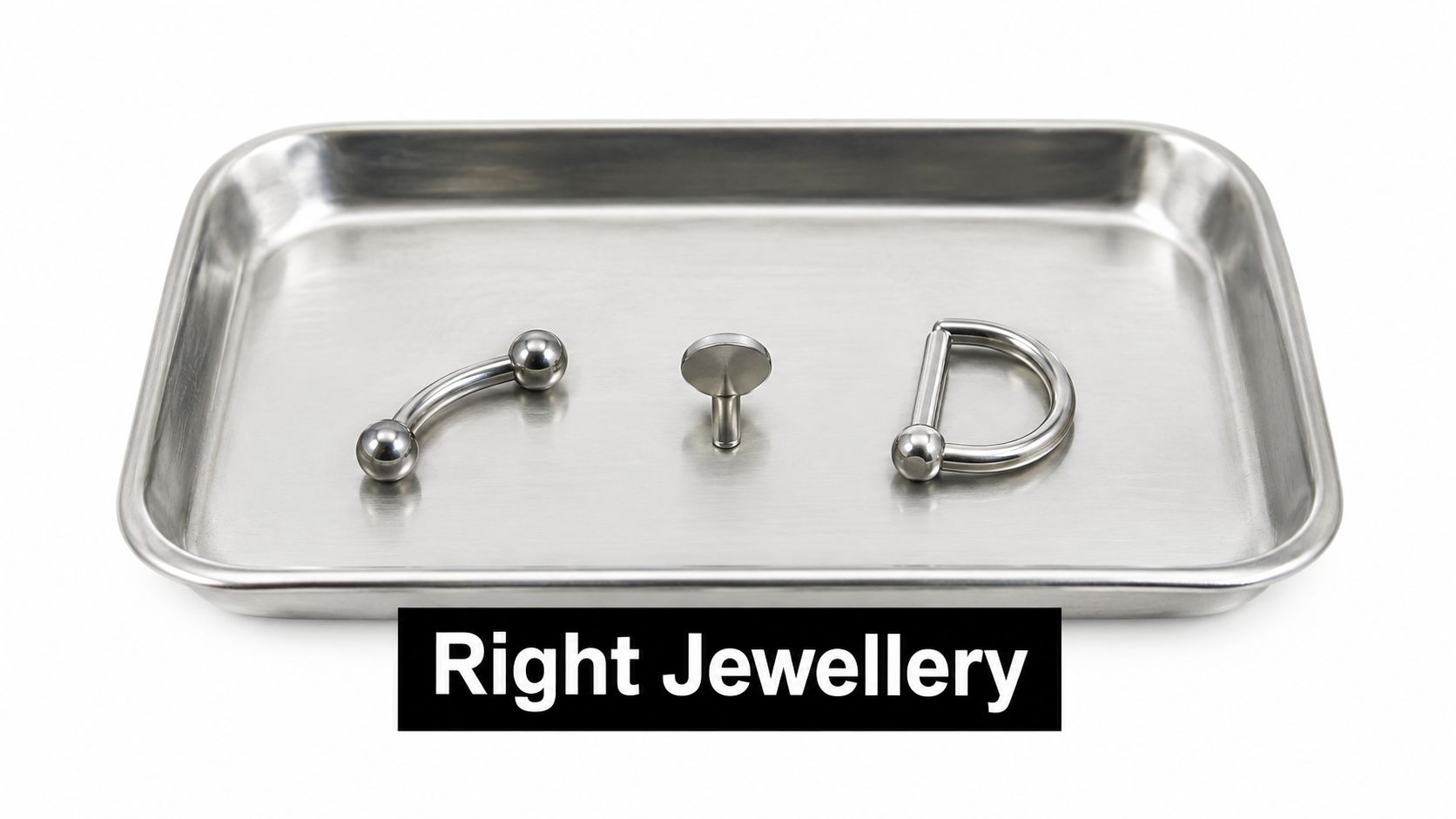 A stainless steel medical tray holding three different types of body piercing jewellery on a white background.