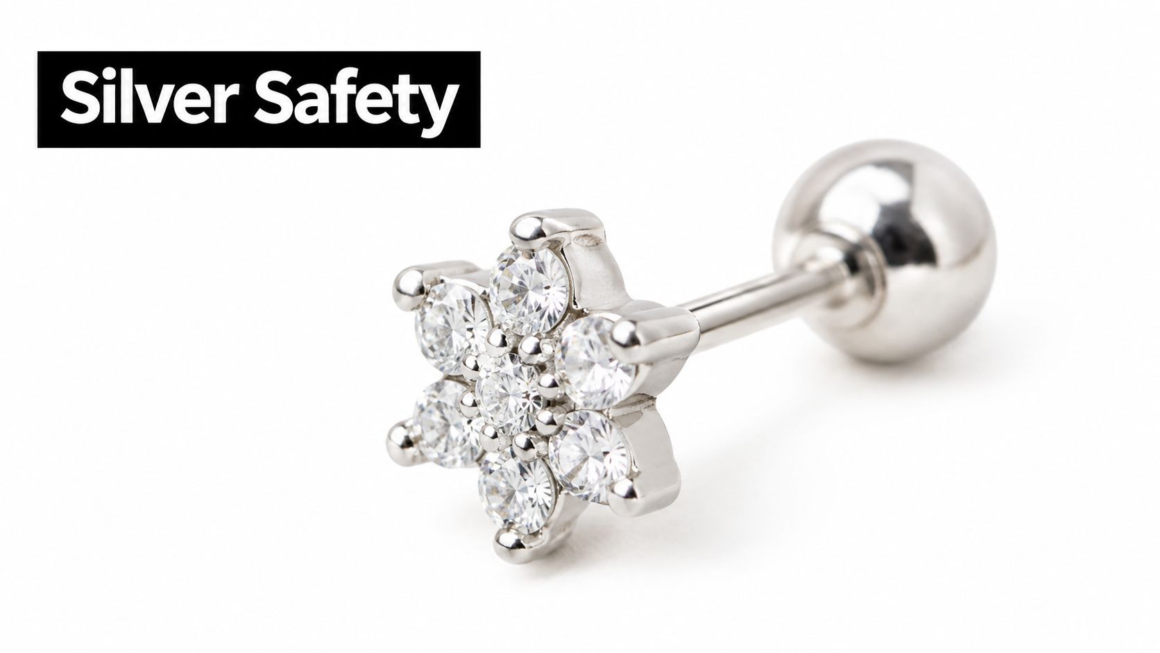A sparkling silver flower-shaped helix piercing earring with multiple clear cubic zirconia stones on white background.